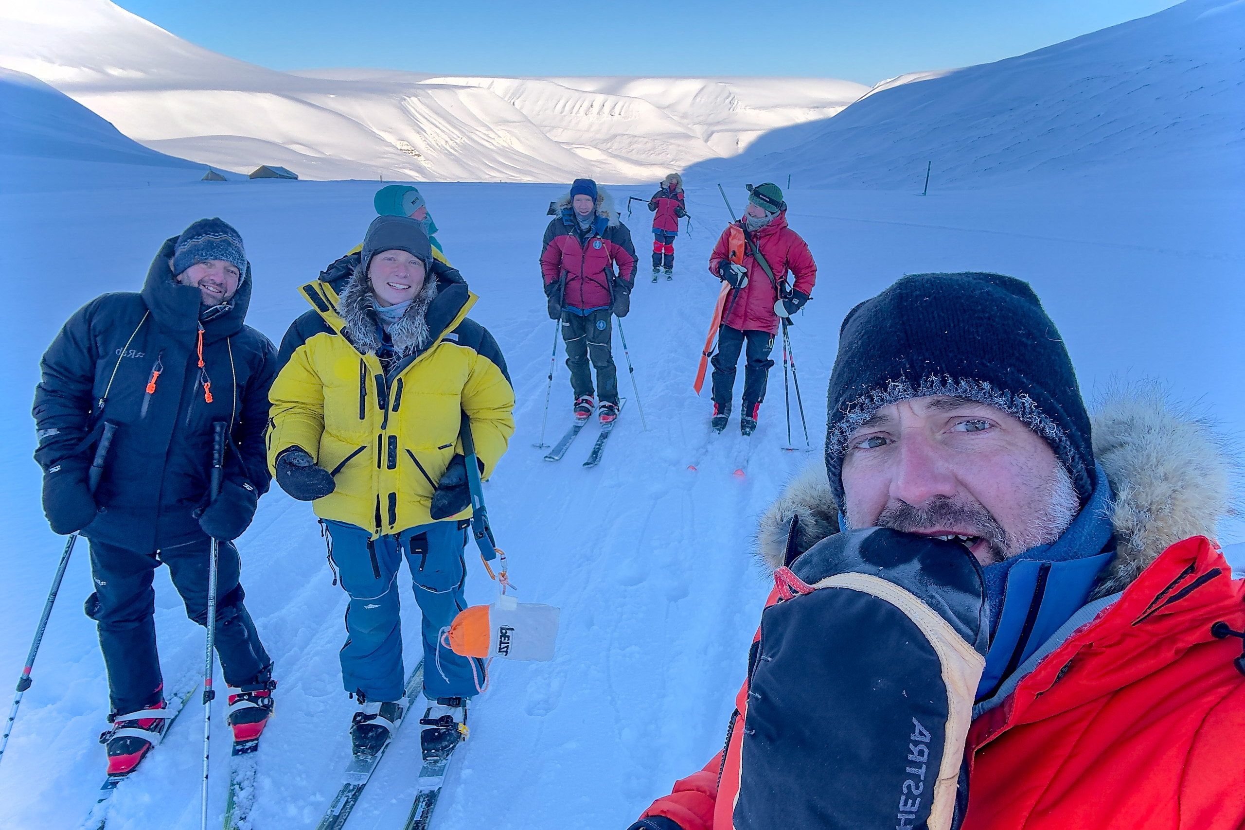 The group on skis on the trail