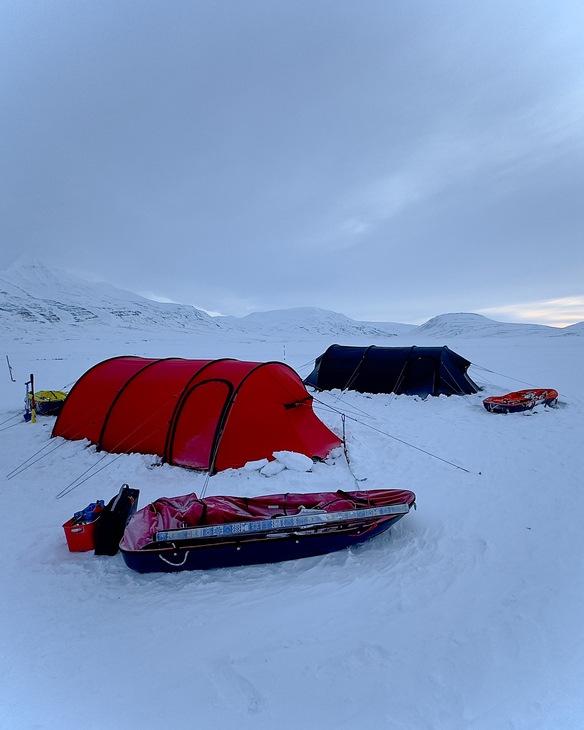 The red tent pitched on the snow